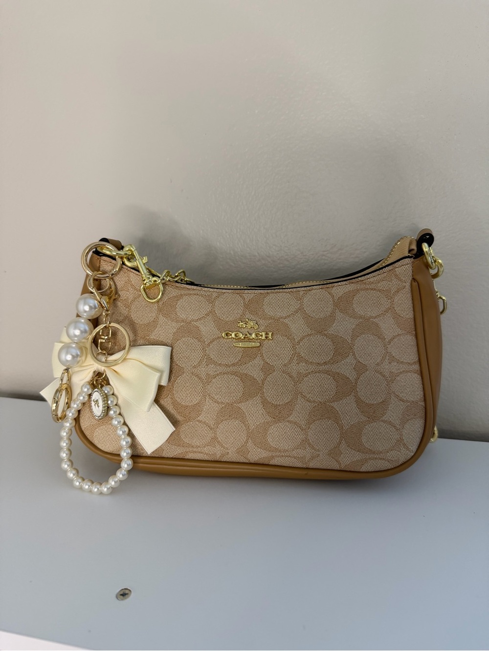 Coach Tan Signature Canvas Shoulder Bag with Pearl Bow Charm